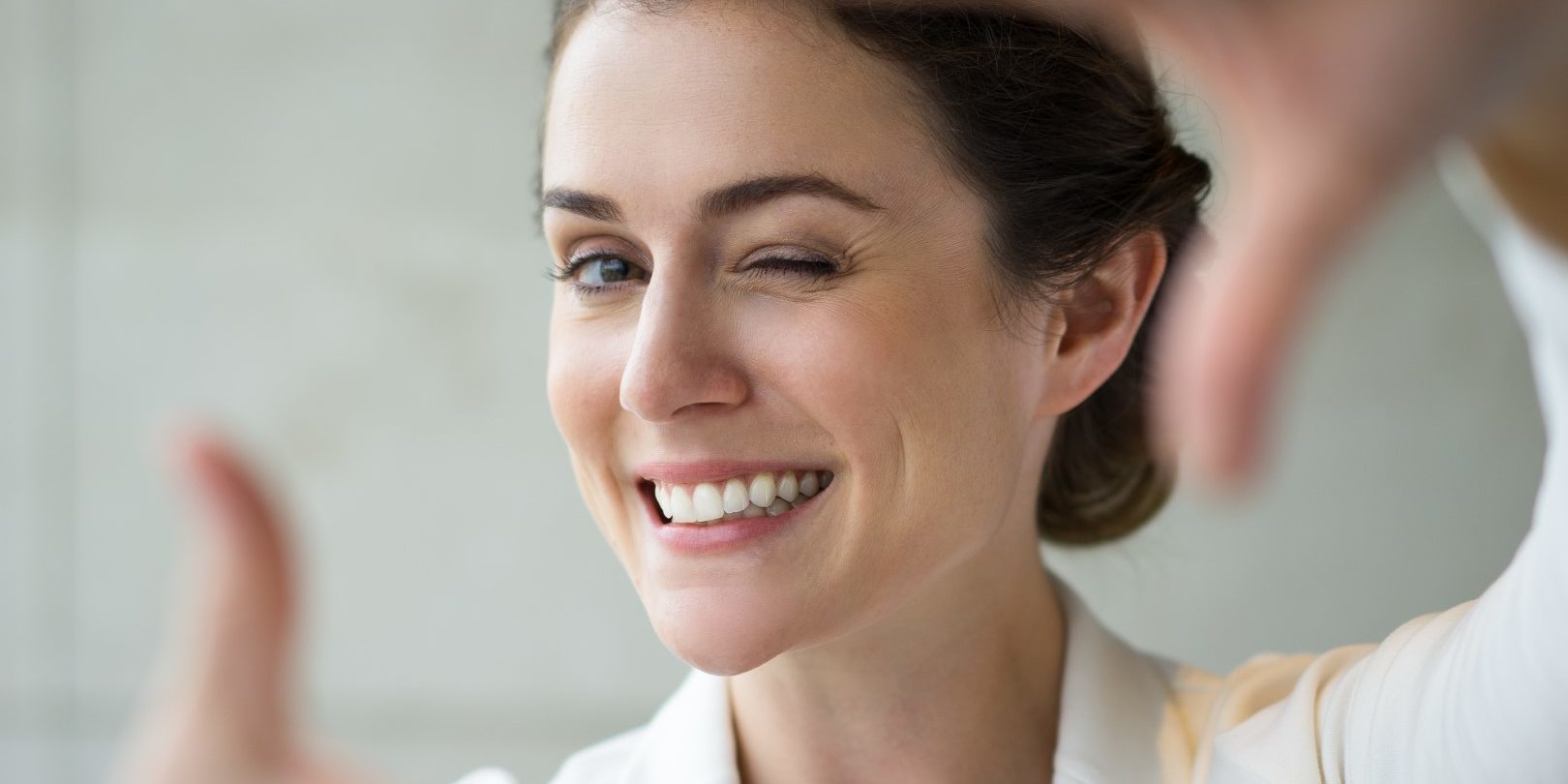 Closeup of Smiling Woman Making Frame Gesture Closeup of Smiling Woman Making Frame Gesture